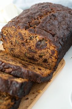 a loaf of banana bread sitting on top of a cutting board