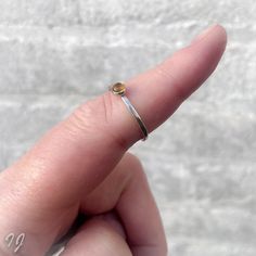 A handmade hammered sterling silver ring with a 4mm Citrine cabochon. Citrine is November's birthstone. Available in sizes 3 through 14, oxidized or bright silver.  - Handmade - Sterling Silver - Size 3 through 14 - Oxidized or bright silver - Citrine Please read my policies before buying: https://www.etsy.com/shop/Draadjuwelen/policy?ref=shopinfo_policies_leftnav Take a look at my other sterling silver rings: https://www.etsy.com/nl/shop/Draadjuwelen?section_id=13764110&ref=shopsection_leftnav_