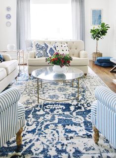 a living room with blue and white furniture