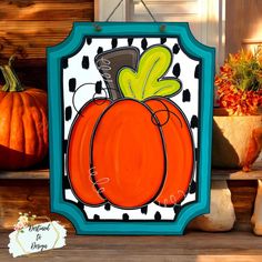 a painting of a pumpkin on the front porch