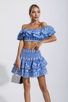 A must for any wardrobe looking youthful is our Dorothy Blue Floral Ruffle Off-Shoulder Set. You'll receive compliments from everyone wearing this set. The printed fabric is structured in layers and trimmed with ruching. The cropped top is paired with a high-waisted cake skirt. Whether you're on vacation or on the go, this set is the perfect fit for you.Top Length: Approx 20cmSkirt Length: Approx 40cmMaterials: PolyesterGentle Dry Clean OnlyModel is 5 ft 74 and wears size SColour may vary due Glitter Wedding Dress, Cake Skirt, Europe Outfits, Bandage Midi Dress, Skirt And Top Set, Floral Shirt Dress, Puff Sleeve Dresses, Maxi Knit Dress, Floral Ruffle