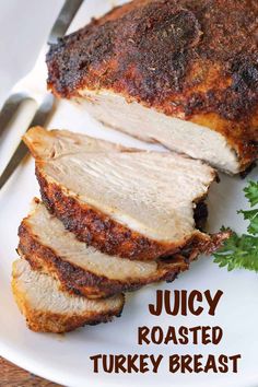 roasted turkey breast on a white plate with parsley