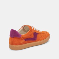 an orange and purple sneaker with two tone detailing on the top, side view