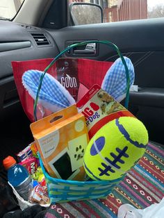 a car filled with lots of toys and gifts in it's trunk, including a stuffed animal