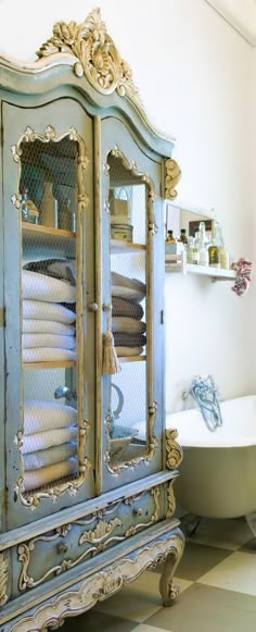 a bathroom with a claw foot bathtub next to a window