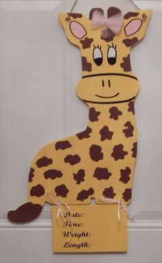 a door hanger with a giraffe cut out of it's body