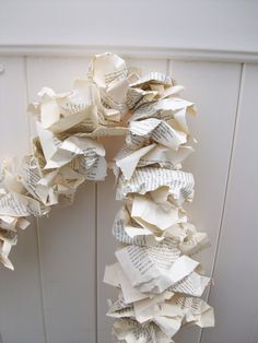 a wreath made out of old book pages