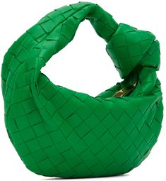 Intrecciato-woven grained lambskin and calfskin top handle bag in green. · Integrated carry handle with knotted detailing · Zip closure · Tonal leather lining · Gold·-tone hardware · H8 x W10 x D3 in Supplier color: Parakeet Luxury Green Bag With Rolled Handles, Luxury Green Bags With Rolled Handles, Green Evening Bag With Braided Handles, Chic Green Shoulder Bag With Intrecciato Weave, Green Woven Leather Evening Bag, Luxury Green Woven Leather Bags, Chic Green Intrecciato Weave Shoulder Bag, Green Top Handle Bag With Intrecciato Weave, Designer Green Bags With Intrecciato Weave