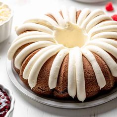 a bundt cake with white icing on a plate