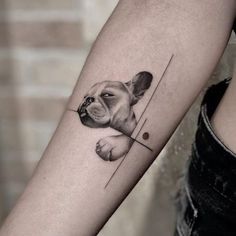 a dog's head is shown on the arm and behind it are two lines