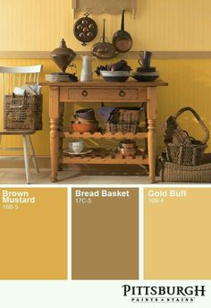 a table with baskets on it in front of a yellow wall and some other items