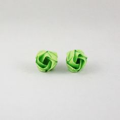 pair of green earrings on white background