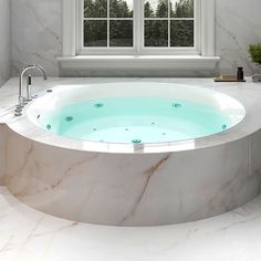 a bathroom with a large jacuzzi tub next to a window in the corner