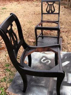 two chairs sitting on top of a cement slab