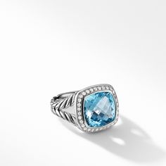 This product is made of sterling silver and features a center blue topaz gemstone and surrounding diamonds. Part of the Albion collection, this design is sure to impress with its vibrant hues and sparkling accents. Ring On Hand, Yurman Ring, Petite Jewelry, David Yurman Ring, Bridal Engagement Rings, Black Orchid, Split Shank, London Blue Topaz, London Blue