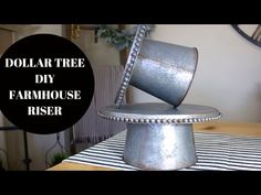 the dollar tree diy farmhouse riser is made out of galvanited metal