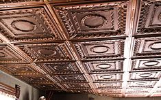 the ceiling is made of metal and has intricate designs