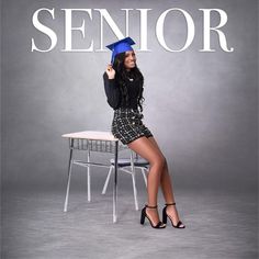 a woman sitting on top of a chair in front of a sign that says senior