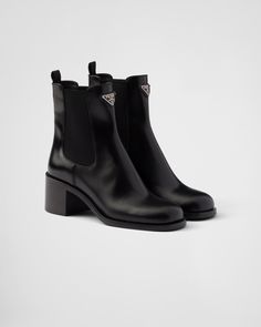 Black Brushed Leather Booties | PRADA Prada Boots Aesthetic, Prada Shoes Outfit, Re Edition Prada, Prada Boots, Ballerina Slippers, Mens Travel Bag, Black Leather Heels, Triangle Logo, Boot Accessories