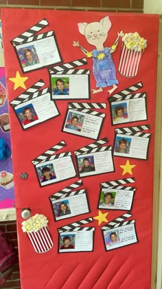 a red bulletin board with pictures on it and popcorns in the middle for movie night