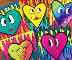 three colorful hearts with faces painted on them in the shape of heart shapes and dripping paint