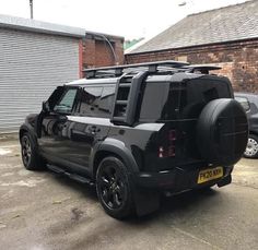 a black jeep parked in front of a building