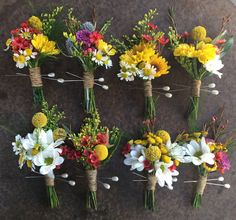 six bouquets of flowers are arranged on the ground