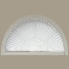 an arched window with the sun shining in it's center and white trims