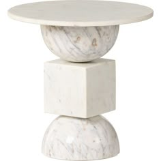 a white table with two marble pedestals on top