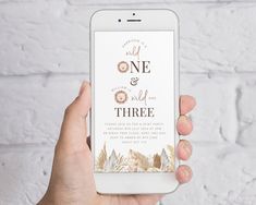 a person holding an iphone with the text, one and only three on it