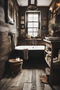 an old fashioned bathroom with wood flooring and antique fixtures, including a claw foot bathtub