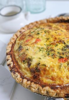 a quiche pie sitting on top of a white counter