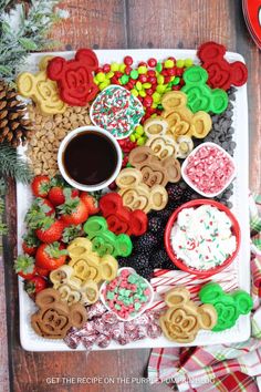 a platter filled with cookies, pretzels and candy