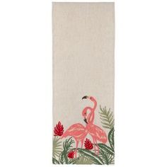 a towel with a pink flamingo on the front and green palm leaves around it