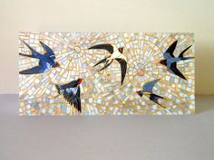 three birds are flying in the sky on a mosaic tile wall hanging ornament