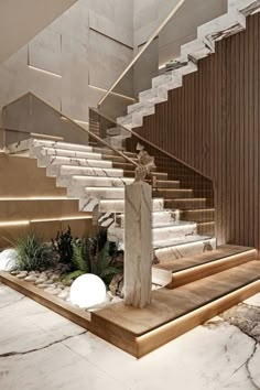 an elegant staircase with marble steps leading up to the second floor