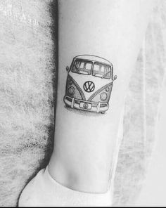 a black and white photo of a vw bus tattoo