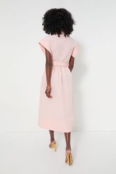 Elegant in its simplicity, the structured and ultra-ladylike Pink Salt Chloe Dress is done in a textured cotton-blend fabric that is sure to turn heads for its design details. The moire pattern throughout and trapunto stitching on the sleeves, placket, and hemline complete this midi moment, making it feel extra special with minimal effort. Pair with heels or flats, sunnies or statement earrings, for day or night, and rest assured that you look fabulous! Spread collar Short wing sleeves Button fr Modern Knee-length Cotton Dress, Feminine Cotton Dresses For Work, Feminine Spring Dresses With Structured Shoulders, Spring Dresses With Structured Shoulders, Spring Dresses With Structured Shoulders And Feminine Style, Spring Structured Dresses, Structured Spring Workwear Dresses, Spring Cotton Midi Dress For Formal Occasions, Elegant Pink Cotton Midi Dress