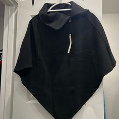 Black Cape Jacket With Zip Top Collar. Size Small. Never Worn. Got As A Gift. Black Cape-style Outerwear For Work, Hooded Black Cape For Fall, Black Hooded Cape For Fall, Casual Black Poncho For Winter, Casual Black Winter Poncho, Black Cape Poncho For Work, Black Cape Outerwear For Fall, Casual Black Cape Outerwear, Black Poncho For Cold Weather In Fall