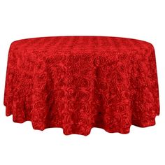 a red tablecloth with roses on it and a white back ground in the background