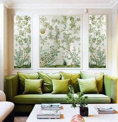 a living room with green and white furniture