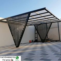 a black metal structure sitting on top of a tiled floor