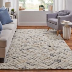 a living room with two chairs and a rug