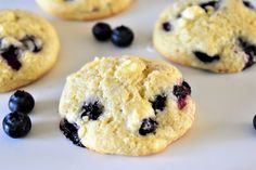 blueberry cookies are arranged on a white plate