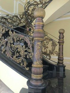 an ornate metal stair railing in a house