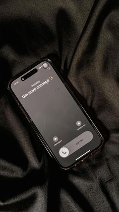 an iphone with the text unplugged on it sitting on a black cloth