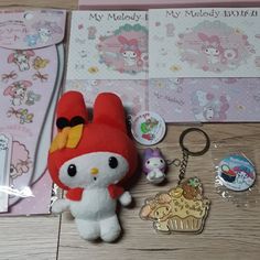 a hello kitty keychain and some other items