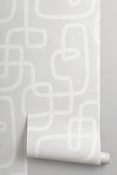 a white wallpaper with an abstract pattern on it's side and the bottom half