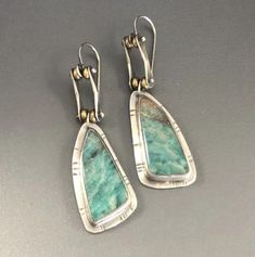 These unique Earrings are a truly exclusive accessory to make any outfit shine. Handcrafted with care, the gorgeous turquoise stones embedded in the intricate framework reflect an enigmatic beauty that's perfect for special occasions and everyday bluejean wearing days. Feel beautiful and confident with these luxury earrings. Geometric turquoise earrings that are trendy & stylish. Join the sustainable and minimalist jewelry movement. Earrings measure 2 inches long and 1/2 inch wide. Includes free Amazonite Earrings, Boho Chic Earrings, Turquoise Drop Earrings, Earrings Handmade Dangle, Insect Jewelry, Chic Earrings, Cool Gifts For Women, Party Earrings, Triangle Pattern