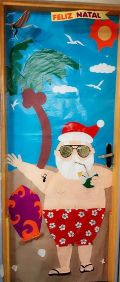 a door decorated to look like santa clause holding a palm tree and wearing red swim trunks